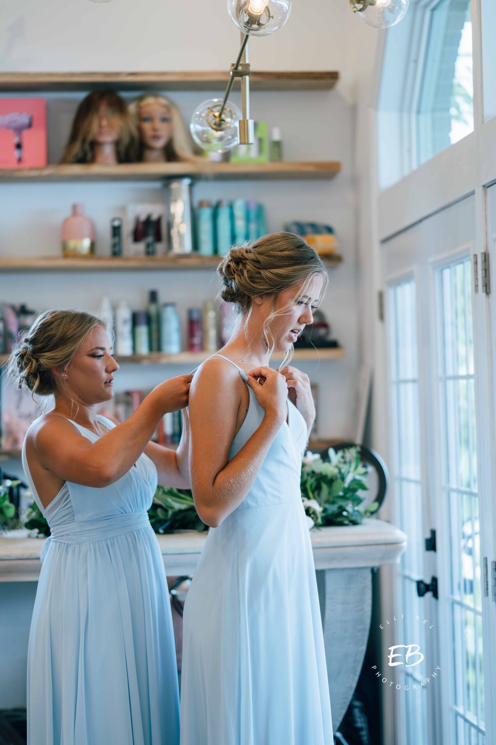bridesmaids helping each other